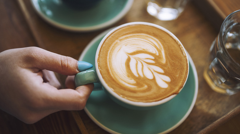 hand holding latte
