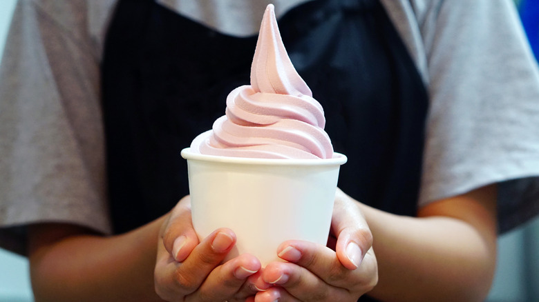 woman holding frozen yogurt