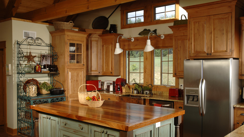 View of blue and brown wood country kitchen