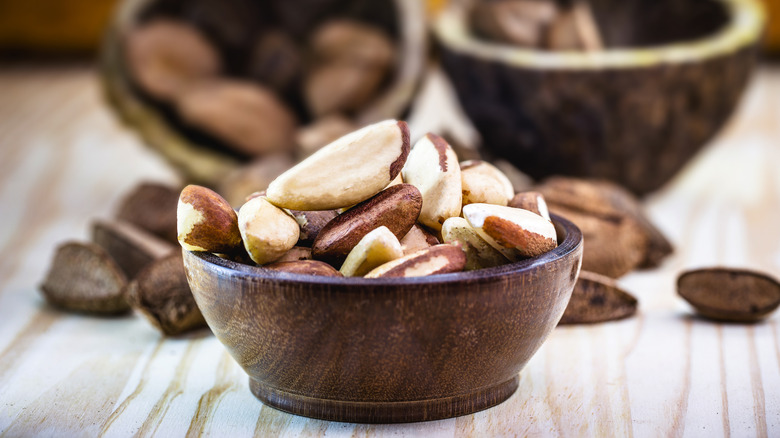 lots of Brazil nuts it wooden bowl