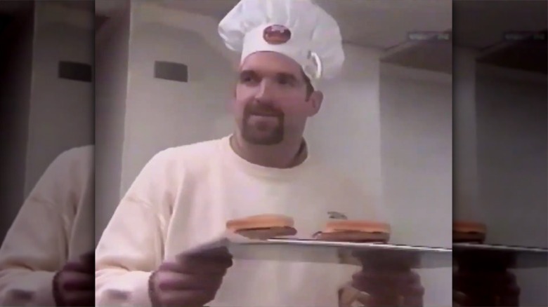 Chicago Bulls center Bill Wennington holding the 1998 McDonald's Beef Wennington burger