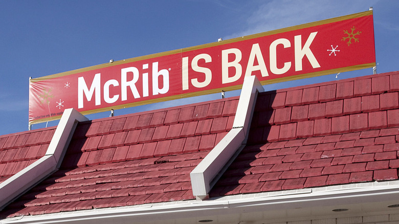 Red sign above McDonald's restaurant reading 'McRib is back'