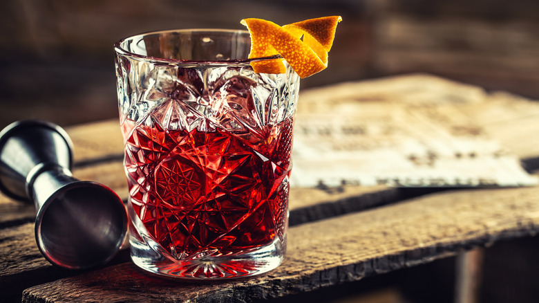 A Negroni cocktail with orange peel