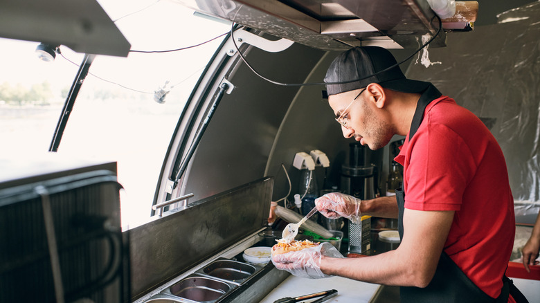 man working in food truck