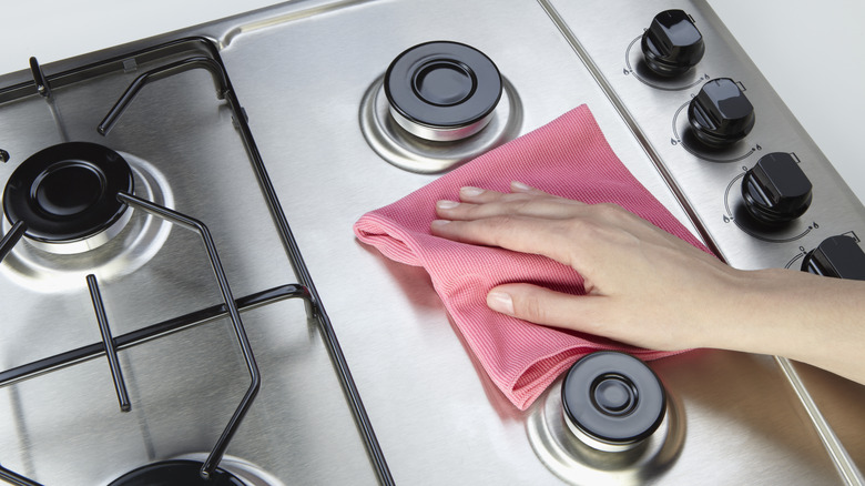 wiping stainless steel stovetop