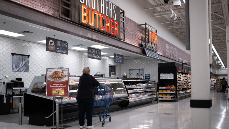 A customer waits at the Meijer butcher counter.
