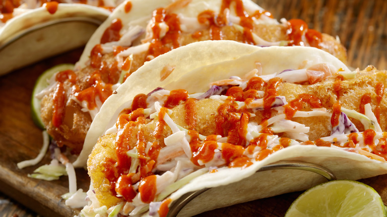 hot sauce drizzled on tacos
