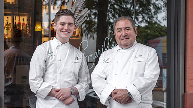 EJ and Emeril Lagasse stand in front of Emeril