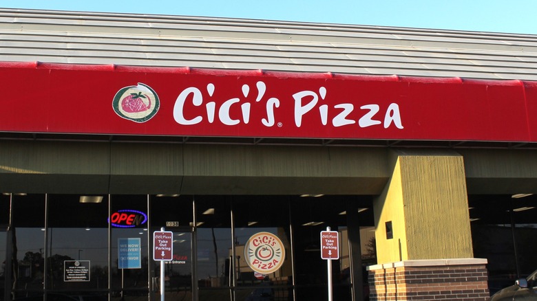 Exterior of Cici's Pizza restaurant with logo on red awning