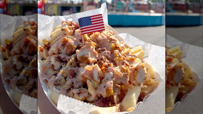 Freedom Fries from Fork 'et Me Not with barbecue ranch sauce, chicken, bacon, and miniature American flag decoration.