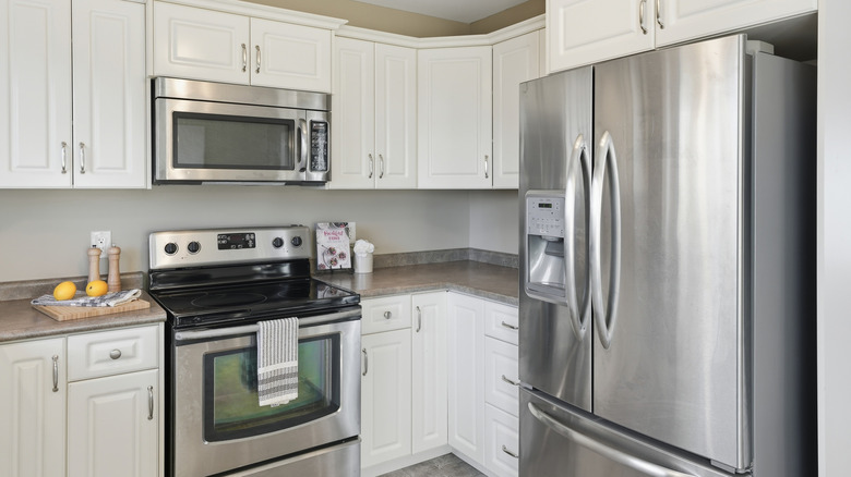 Kitchen with a stainless steel French door fridge and modern appliances