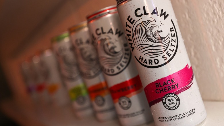 A row of White Claw cans in a variety of flavors