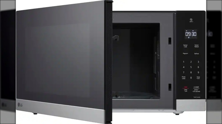 LG microwave with door slightly open