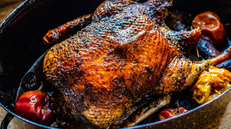 Whole roasted duck in pan