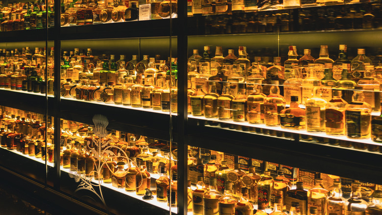 a large variety of whiskeys on display