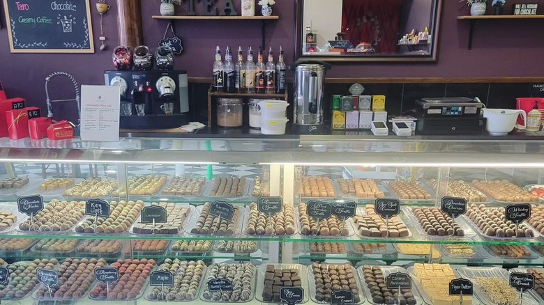 A fridge counter with candy and chocolates