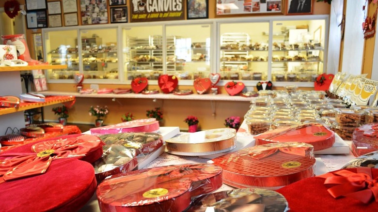 Haert-shaped candy boxes on a table in a candy store