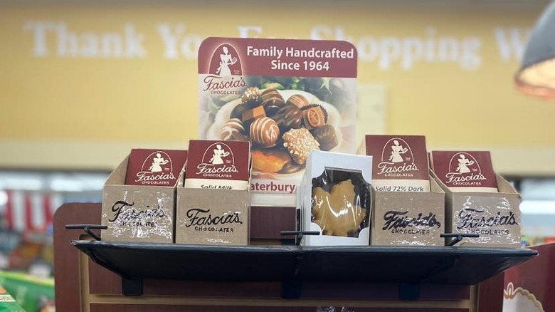 Chocolate in boxes on a shelf with 'Fascia's' branding