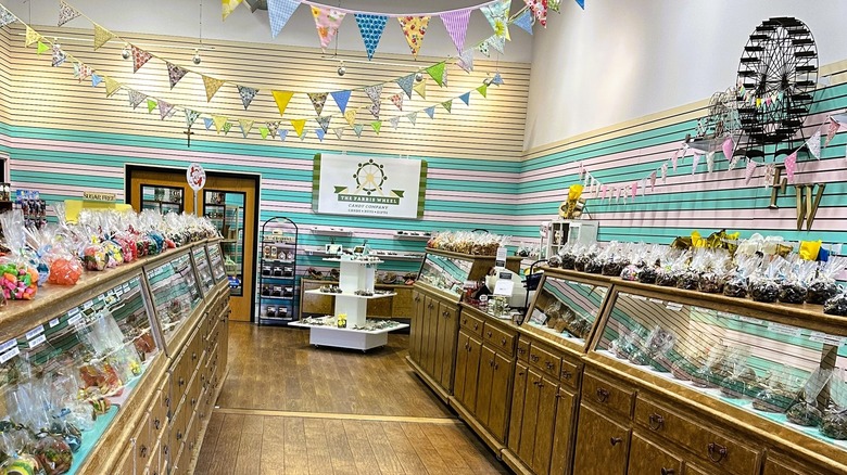 Inside a candy store with wooden floors and bunting