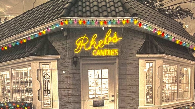 A chocolate advent calendar showing a candy store with the name Rheb's Candies
