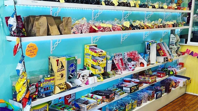 Shelves in a candy store stocked with candy