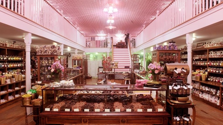 Inside a candy store with a pink roof and landing
