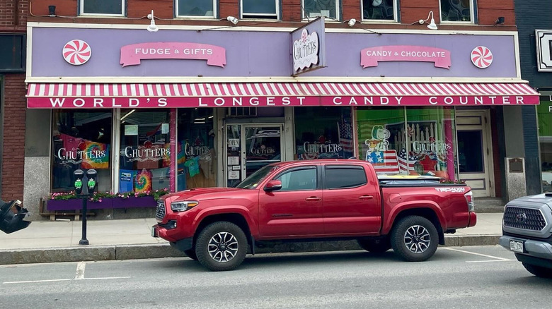 A candy store with a sign saying 'World's longest candy counter'