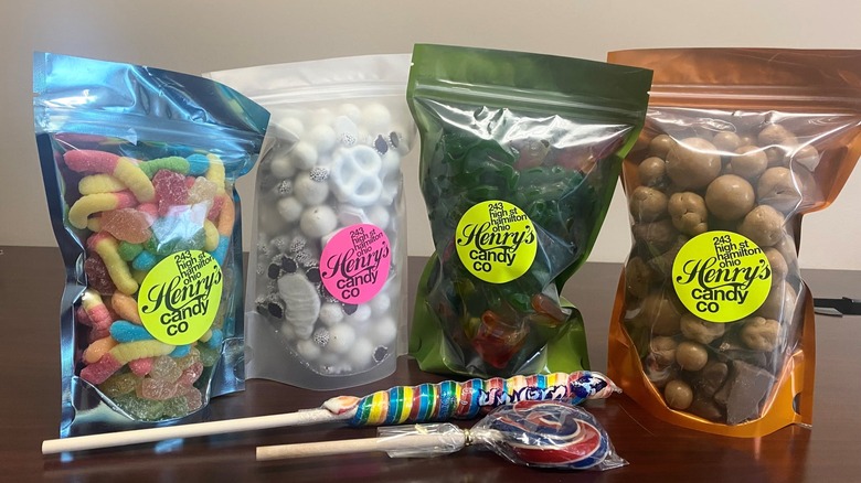Bags of candy, a lollipop and a sucker sweet