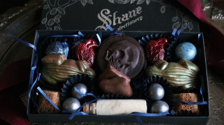 Halloween candy in a black box with blue ribbon