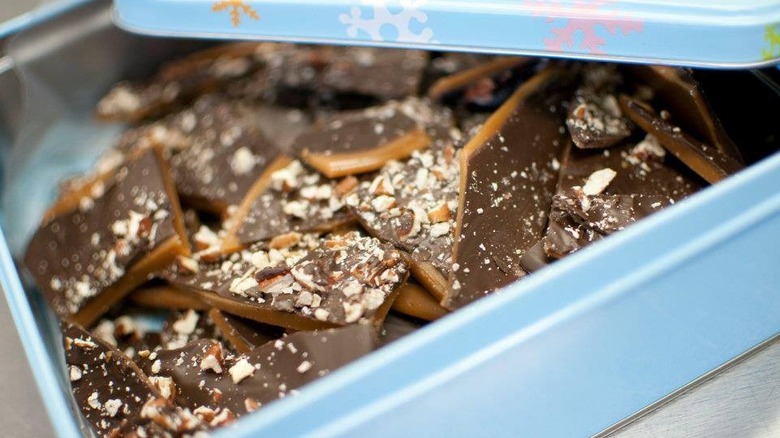 Peanut butter brittle in a blue tin