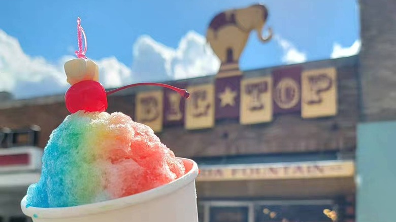 An iced treat in front of a sign that says Big Top