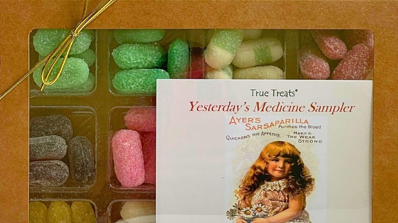 A box of candies with a picture of a girl on the front