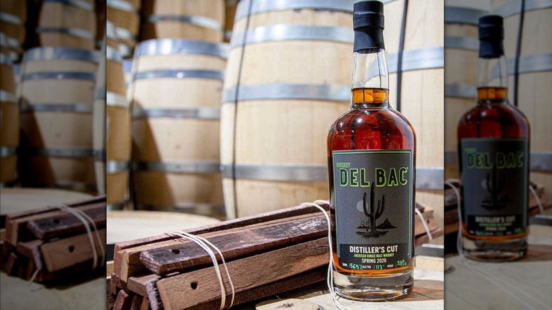 A bottle of Distiller's Cut in a barrel room.
