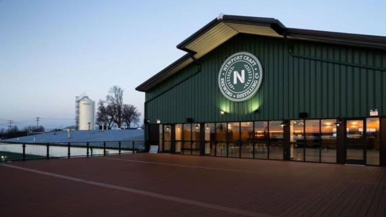 An external shot of the Newport Craft tasting room and production facility at dusk.