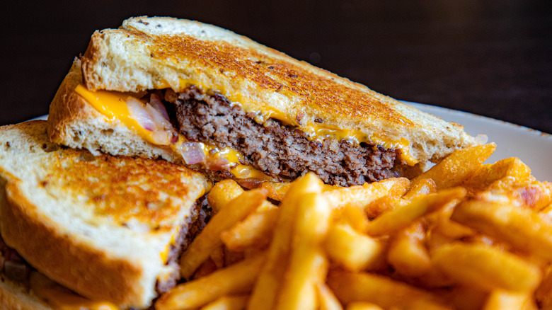 A patty melt with fries