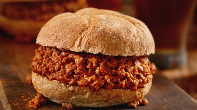 A sloppy joe on a chopping board