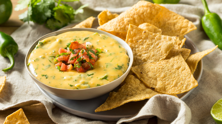 Queso in bowl with chips 