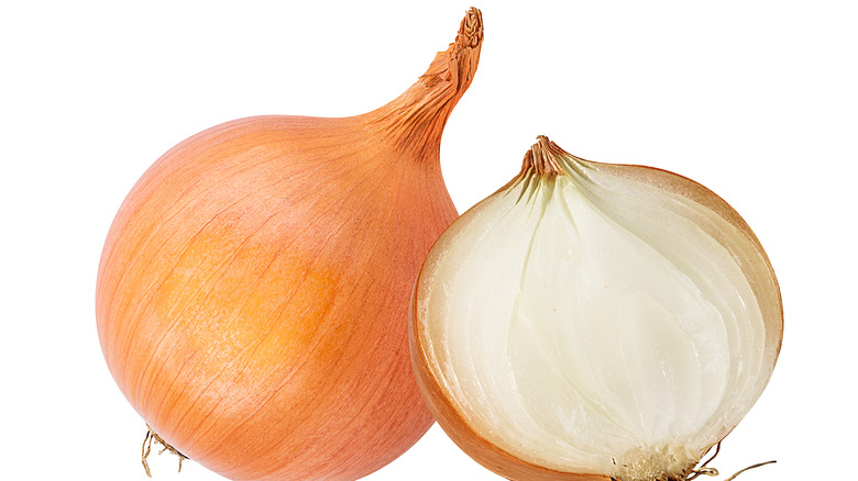 Yellow onions on white background