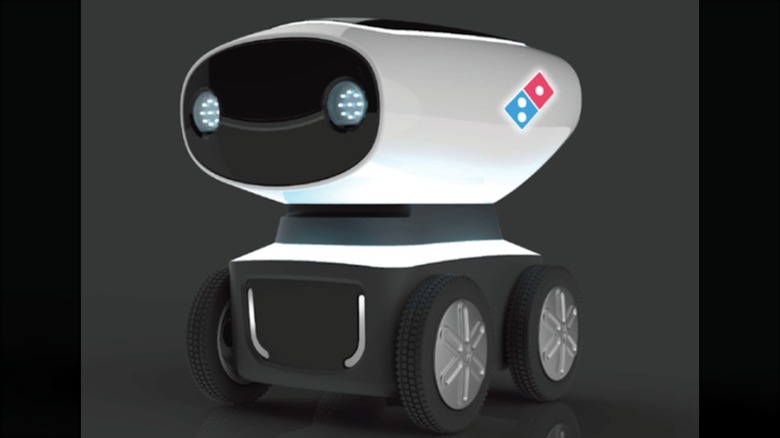 Small robot with four wheels and Domino's logo on the side