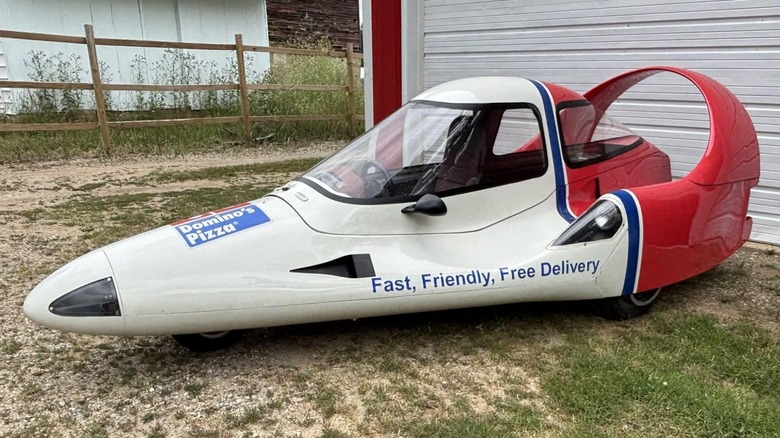 Red and white Domino's branded Tritan vehicle