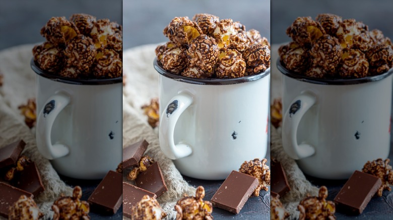 cocoa covered popcorn in white mug