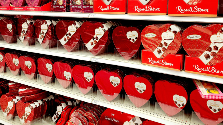 Red heart-shaped Russell Stover boxed chocolates on store shelves