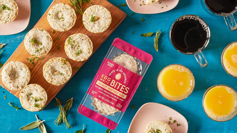 Trader Joe's egg bites on board and inside package with juice and coffee