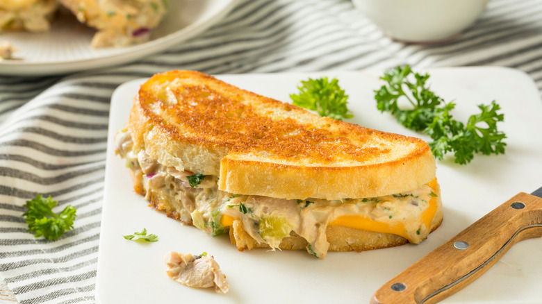Tuna melt on plate with curly parsley