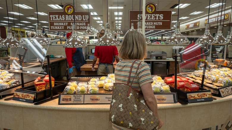 Shopper standing at Buc-ee's sandwich counter