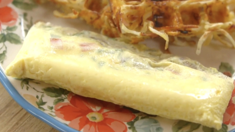 A boiled omelet made in a bag with waffles on plate