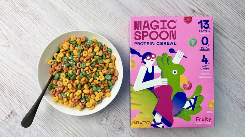 A bowl of Magic Spoon Fruity Protein Cereal sits next to the box.