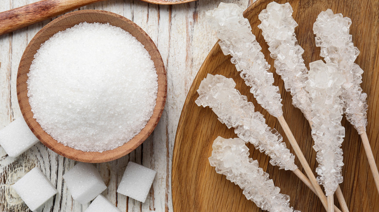 Rock candy with raw sugar on a table.