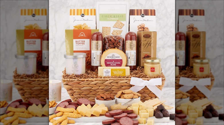 A Hickory Farms gift basket with crackers, cheese, mustard, sausage, and snacks