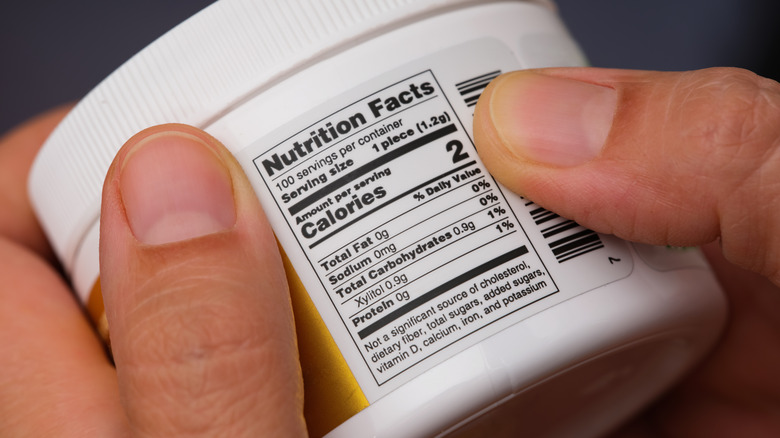 Hands holding jar nutritional facts